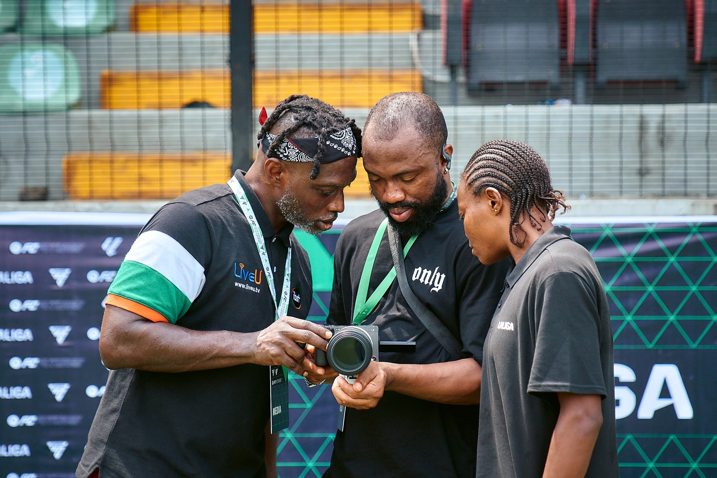 IBST Media sports production team reviewing camera footage at a stadium